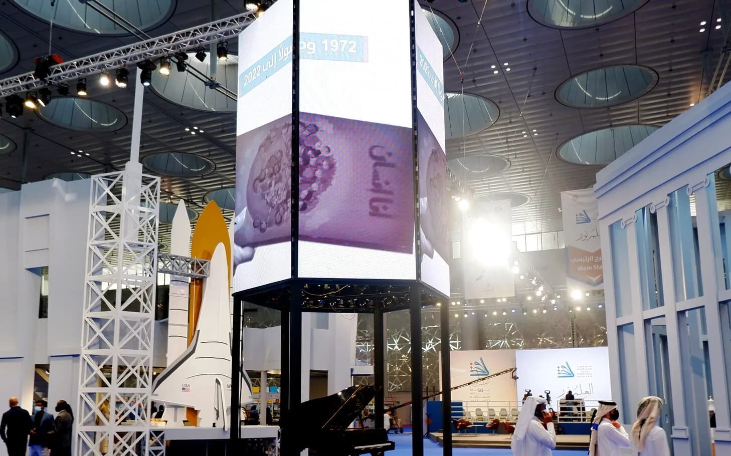 Custom exhibition stand design with interactive LED tower installation at a major Gulf trade show