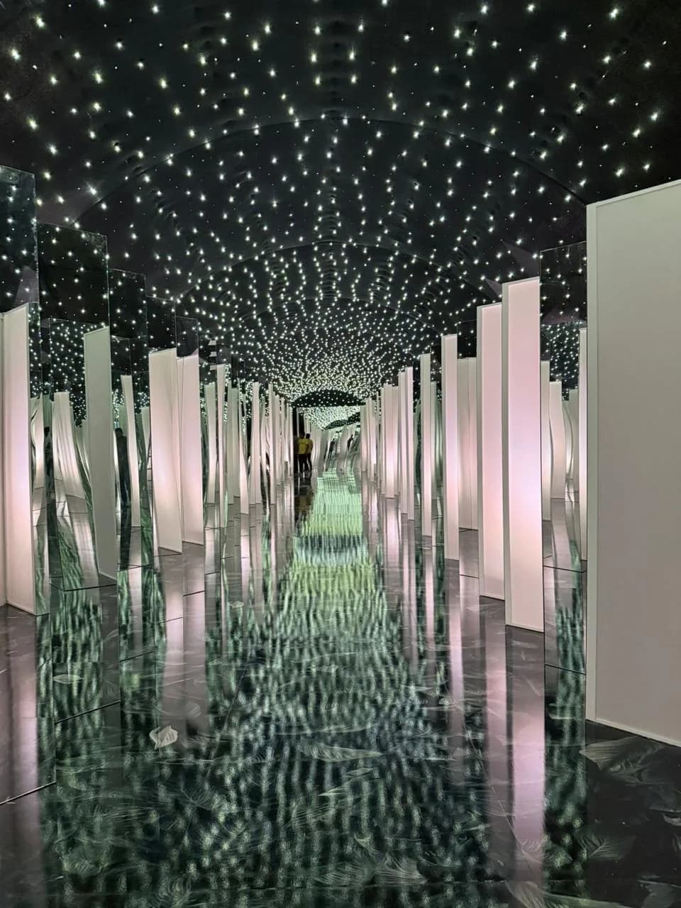 Illuminated mirror walkway installation for a luxury wedding entrance