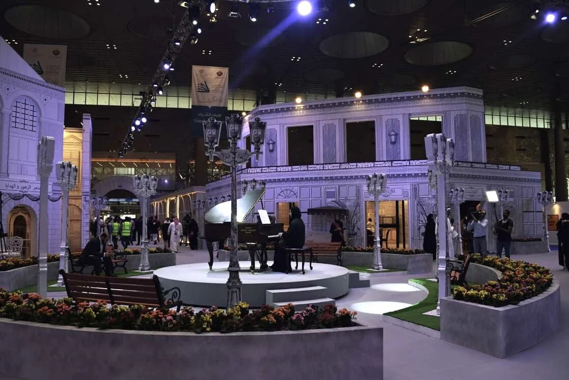 Elegant themed plaza build with live piano performance for a gala wedding evening